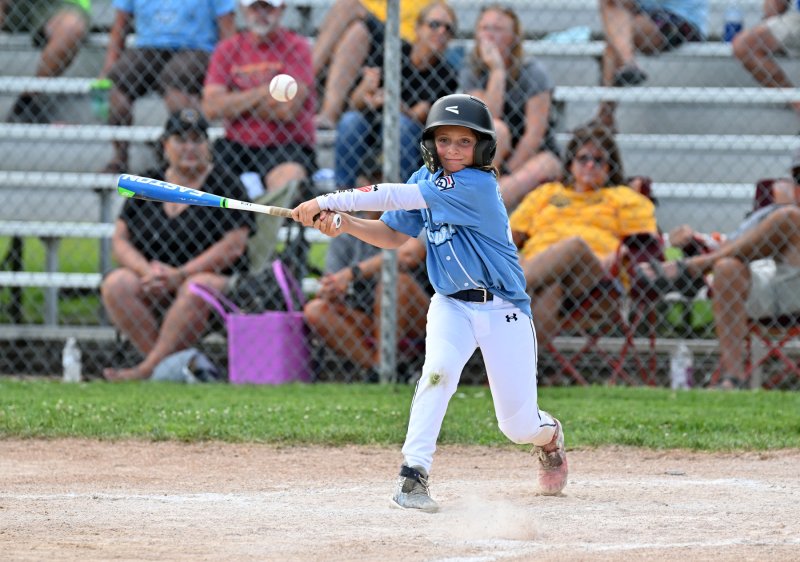 Lewes’ Austin Coulter pushes a ball down the left-field line.