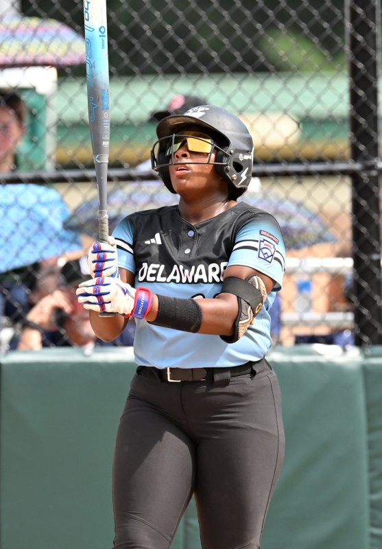 Delaware third baseman Jordynn Bowe checks out her grip.