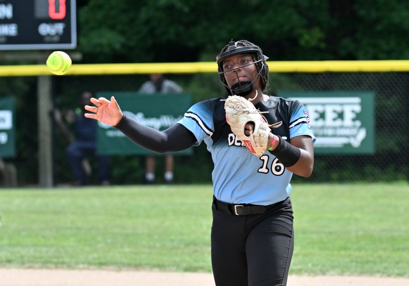 Delaware second baseman Cierra Lewis throws to first for an out.
