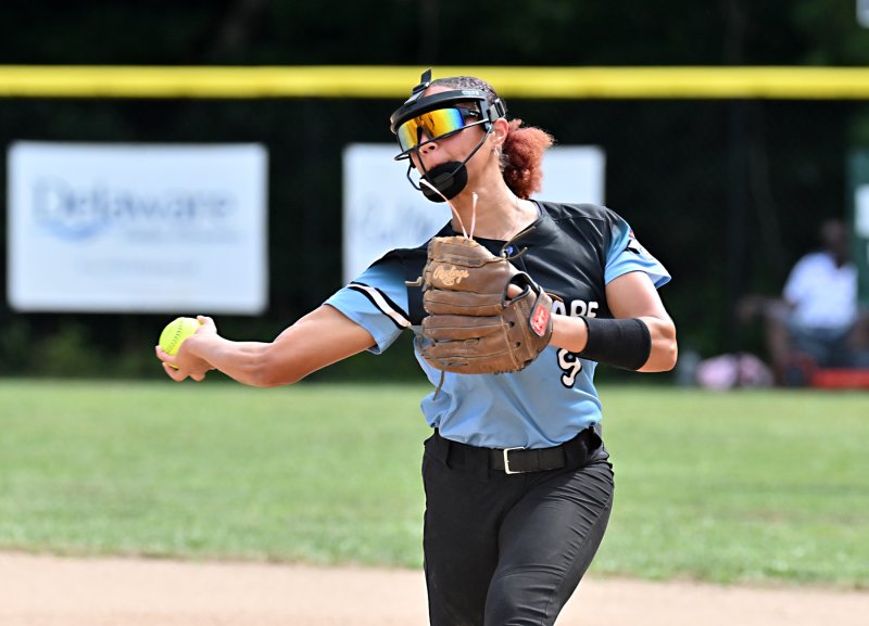 Delaware shortstop Kimora Harris throws to first for an out.