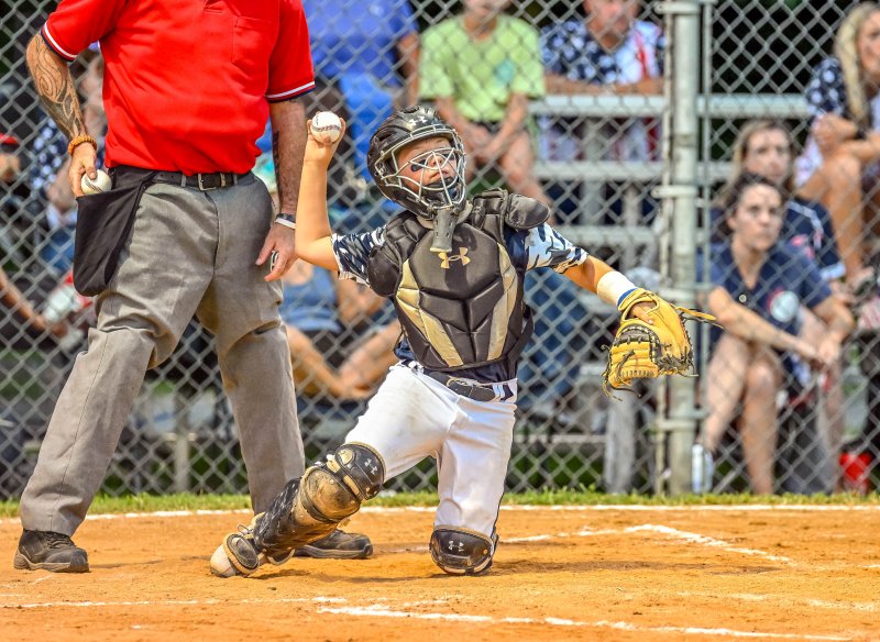 Milton catcher Bryce DeLacy. throws down to second on a steal attempt.