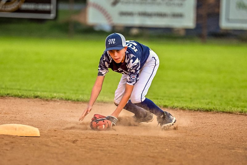Milton shortstop Jaxon Kulp shows his range by smothering a hot grounder and throwing to first for an out.