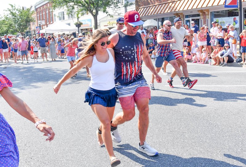 Matt Mullins, right, gets an assist in the adult three-legged race from his daughter Grace.