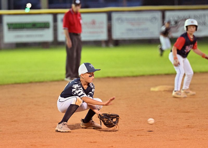 Henry Hill scoops up a ball at the hot corner.