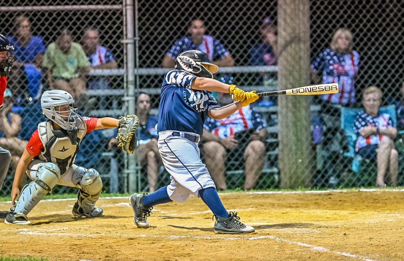 Milton’s Brock Davis takes a mean cut at a pitch.