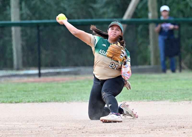 Asia-Pacific’s Nice Lobrido throws to first for an out.