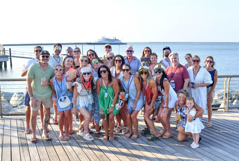 Lots of friends and their connections get together for a picture at Rocking the Docks.