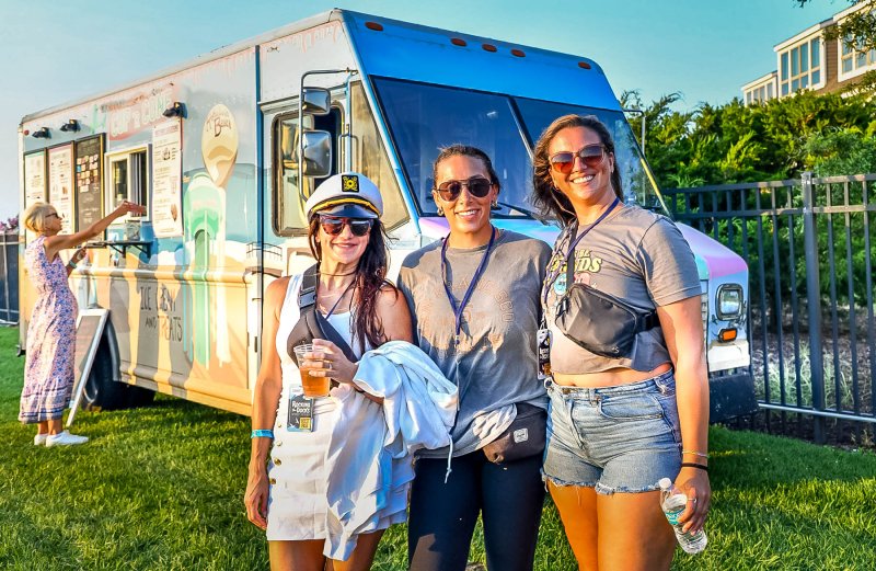 Waiting for a delicious cup of ice cream from the Cup ‘R Cone truck are (l-r) Sarah Smith, Dana Bradley and Lindsey Dimuzzio.