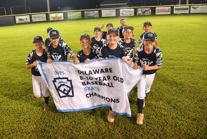The Milton 8-10 all-stars circle Kiwanis Field with the 2025 state championship banner. Milton defeated MOT 8-7 in a close back-and-forth game. DAN COOK PHOTOS