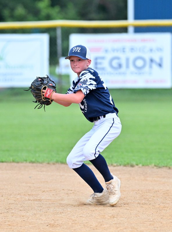 Milton second baseman Jacob Reynolds vacuums up a hot grounder and throws to first for an out.