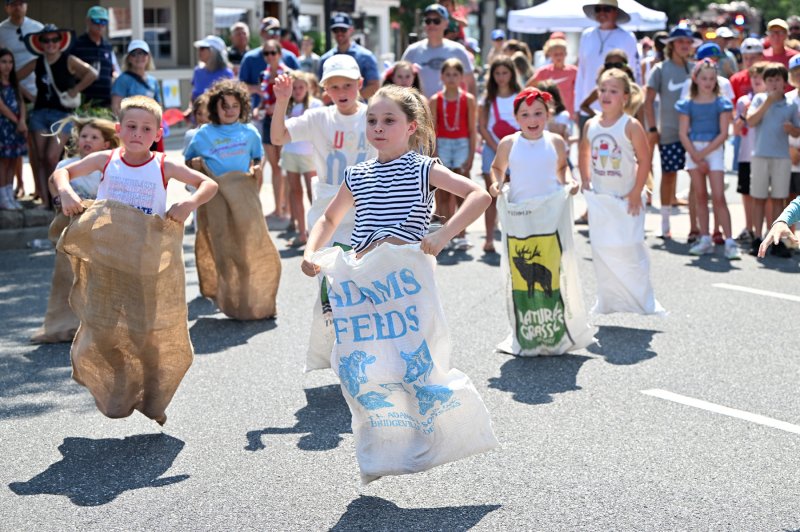 Willa Hoehn, 8, takes the lead in the sack race.