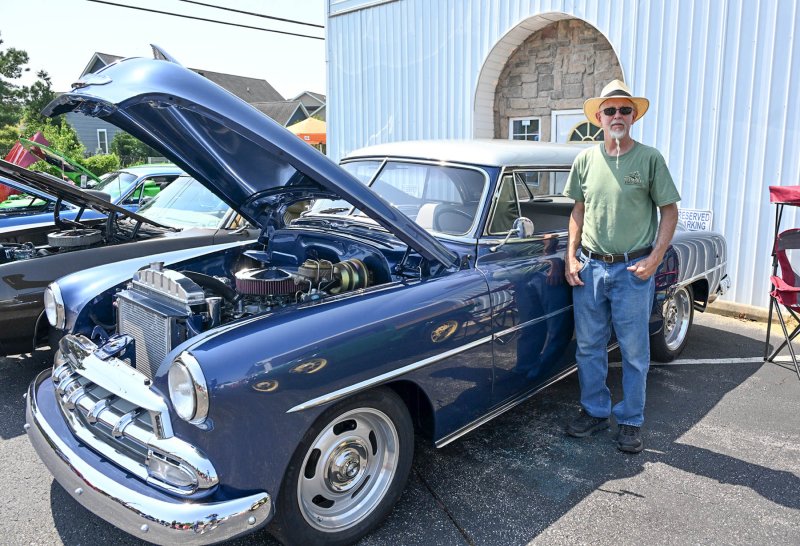 Tracey Coover stands with his 1952 Chevy BelAir.