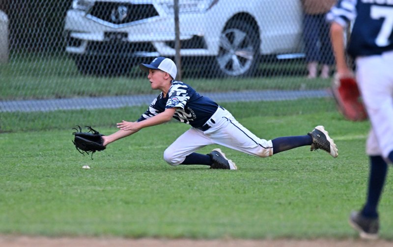 Milton left fielder Wyatt Dean makes a diving attempt on a hit.