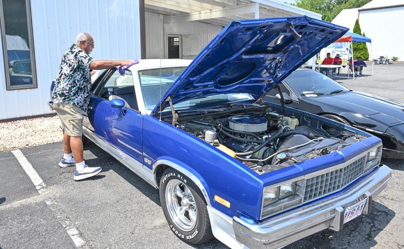 Walt Wright gives his 1988 Chevy El Camino a wipe down. It was the last year the El Camino was made.