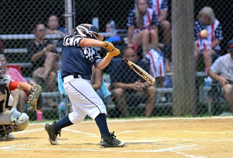 Brock Davis gets a hit for the Milton team.