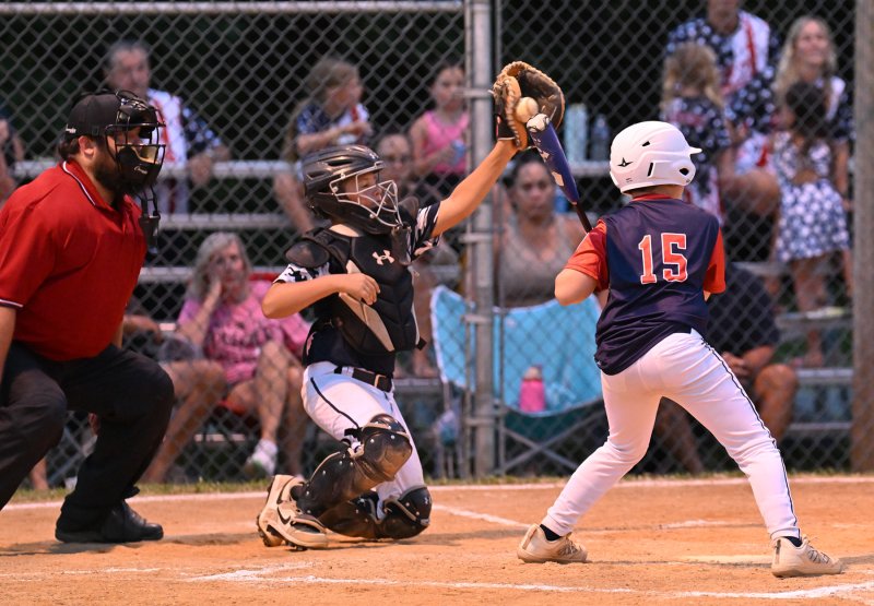Milton catcher Jase DeLacy saves a high pitch.