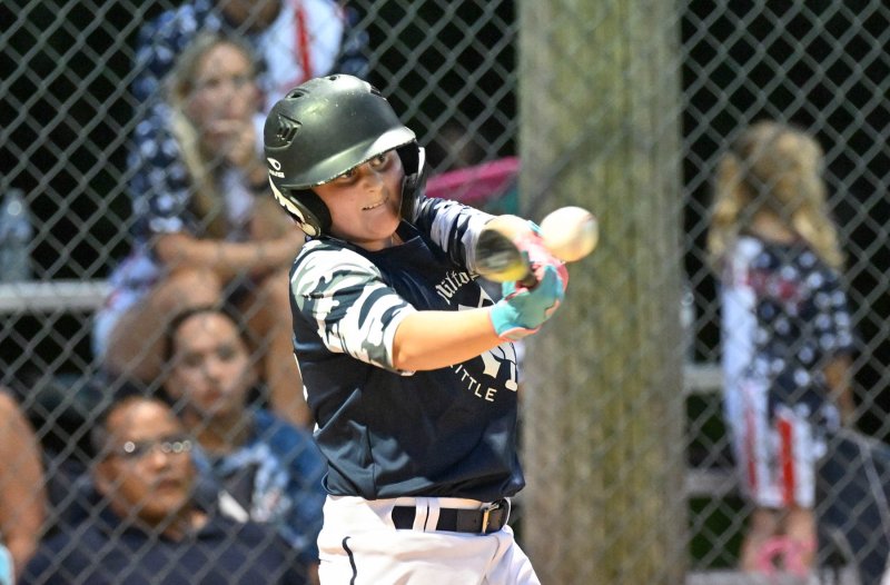 Krew Johnson slams a hit for an RBI.
