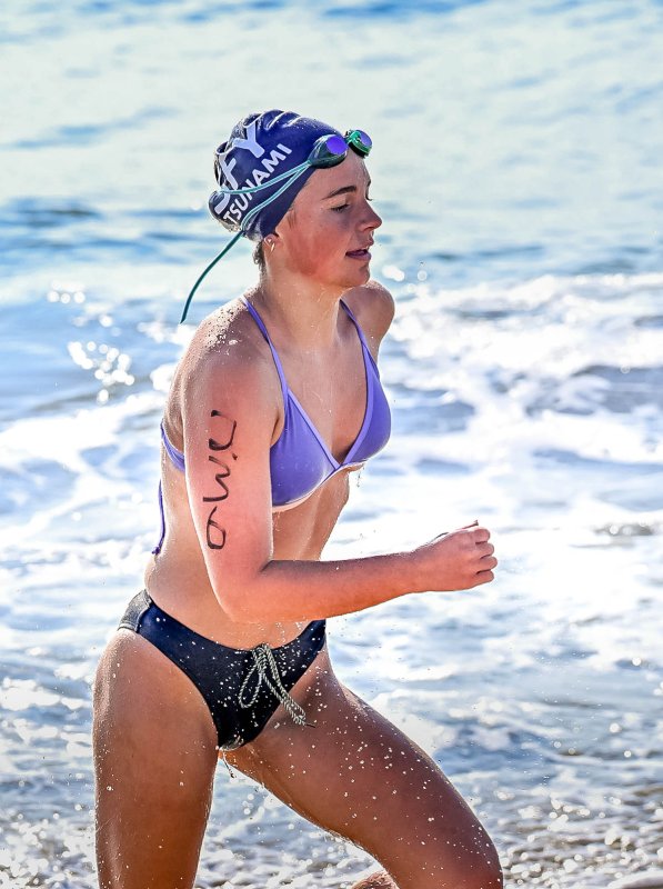 Lily Touw exits the surf after the swim.