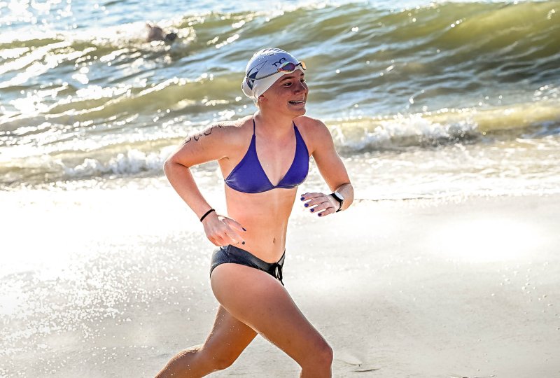 Willet Cole, 15, of Lewes runs from the Atlantic and proceeds to run to a seventh-place finish in 38.38.8.