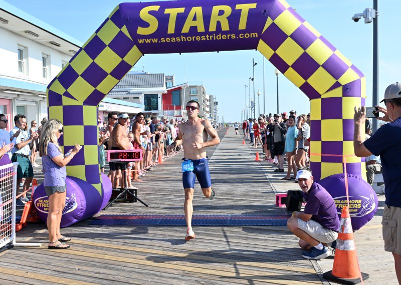 Sean Saxton crosses the finish line in first place.