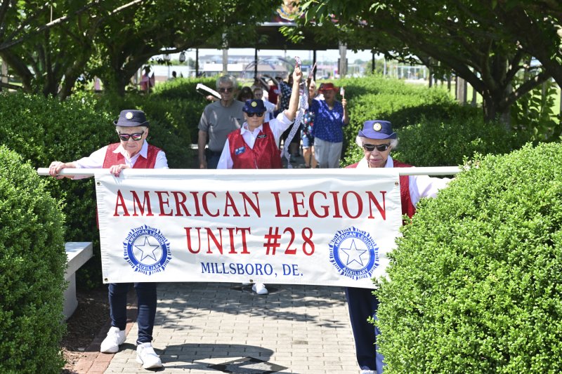 The Makenzie Youth Parade is led by (l-r) Darlene Haus, Barbara McBride and Margaret Hopkins of the American Legion Auxiliary Unit 28 Color Guard. TED PFIRRMANN PHOTOS
