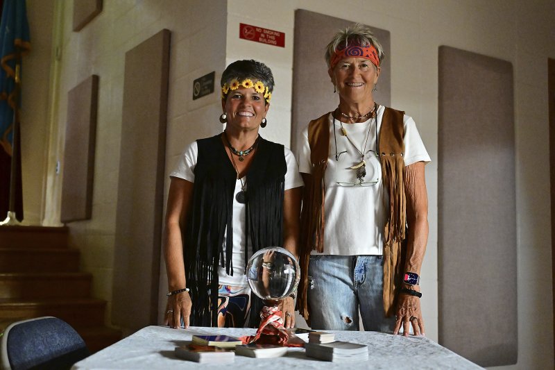 Tammy Jackson and Anna Fugitt offer tarot card readings.