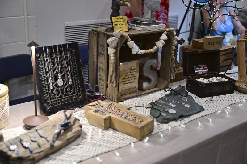 Jamie Forshey with Sunburst Cove Studios displays her goods at the party.