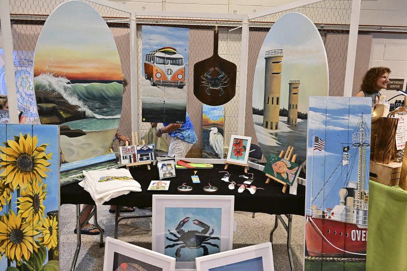 Kim Schuler, owner of Reimagined, repurposes old wood into works of art.