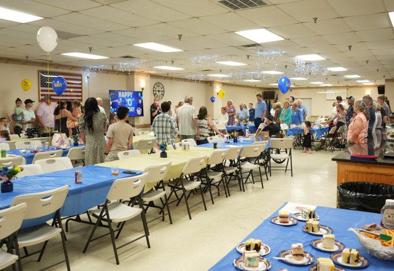 Raymond Sproul’s family and friends gather for his 100th birthday party at American Legion Post 28.
