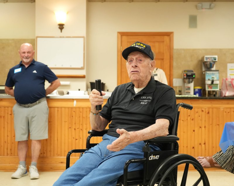 Raymond Sproul shares stories at his birthday party.