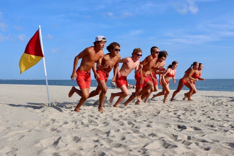And they’re off! Lewes rookie lifeguards start off in the beach sprint. Nine first-time members of the Lewes Beach Patrol competed for bragging rights in the annual test July 23. Shown are (l-r) Eric Lewis, Jaxen Edwards, Connor Evans, Luke Edwards, Braden Jones, Cole Parker, Marlise Harris, Savannah Couch and Sarah Bieler.