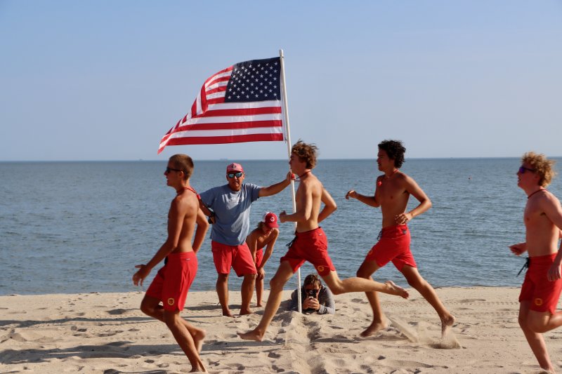 The rookies cross the finish line during one of the sprints down Johnnie Walker Beach.