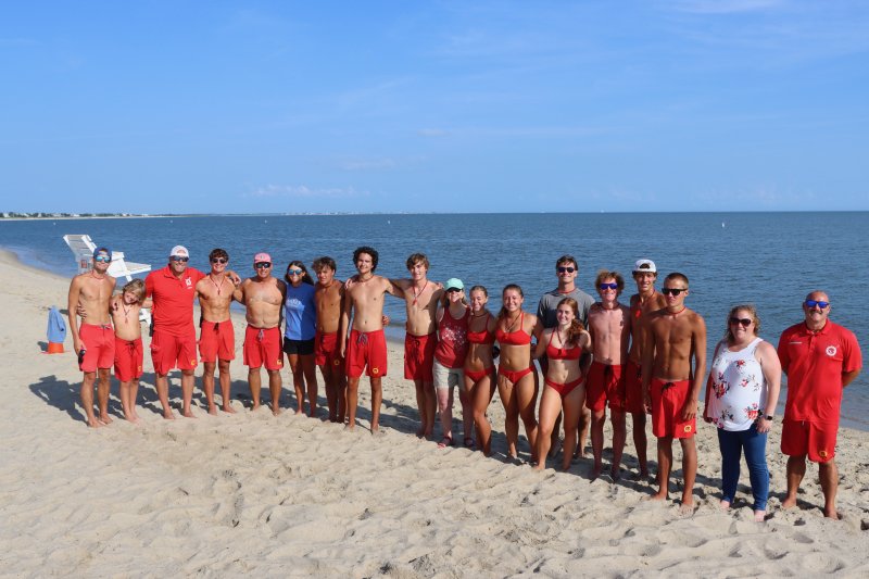The 2025 rookie lifeguards with Lewes Beach Patrol leadership and city officials. Shown are (l-r) Jaxon Laux, Mason Edwards, LBP Capt., Strohm Edwards, Jacob Madden, LBP Chief Mark Woodard, Cassidy Thomas, Jaxen Edwards, Braden Jones, Cole Parker, Mayor Amy Marasco, Savannah Couch, Sarah Bieler, Marlise Harris,
LBP Lt. Landon Hudson, Connor Evans, Eric Lewis, Luke Edwards, Lewes Parks and Marina Administrator Giulia Kirsch and LBP Lt. Matt McDonough.