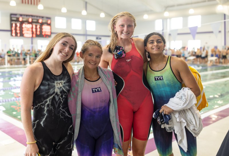 Winning the girls’ 15-18 200 medley relay with a record swim of 1:50.68 is the team of (l-r) Gretchen Maughan, Victoria Evans, Anna Kirby and Mia Jaoude. BECCA NEUFELD PHOTOS