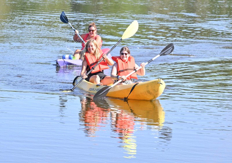All smiles during kayaking. Volunteer Danielle Griffith is the lifeguard in the back kayak while Lori Smyth and Morgan Jungling are in the front.