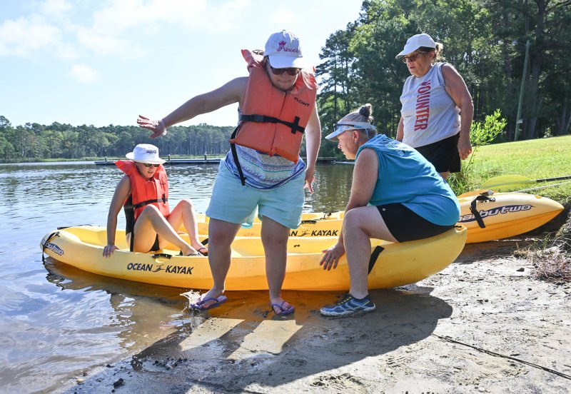 Safely leaving the kayak are (l-r) Brianna Potter, Ariana Froh, Liz Ballini and Marilyn Moore.