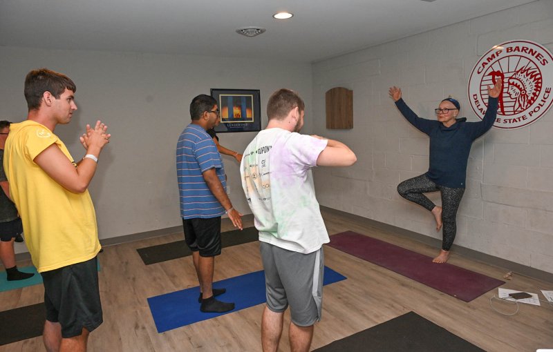 Yoga instructor Mary Bradley gets the athletes loose for their camp events.