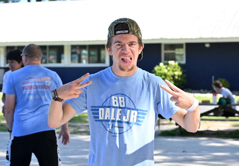 Athlete Austin Quackenbush celebrates his victory on the basketball court.