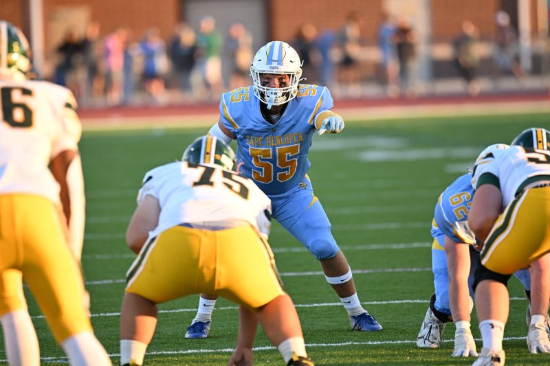 Cape senior linebacker Mason Schaffer points out a formation before the Saint Mark’s snap.