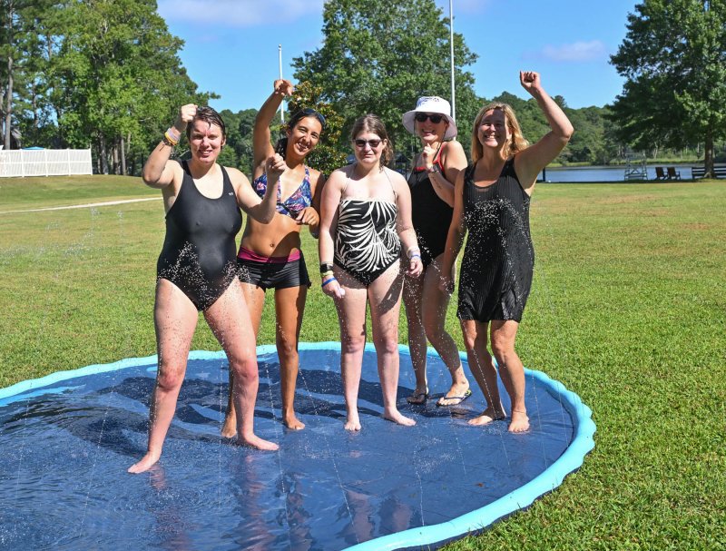 Getting the groove on dancing on the water soaker are (l-r) Sara Giles, Sara Perrotta, Morgan Jungling, Brianna Porter and Lori Smyth.