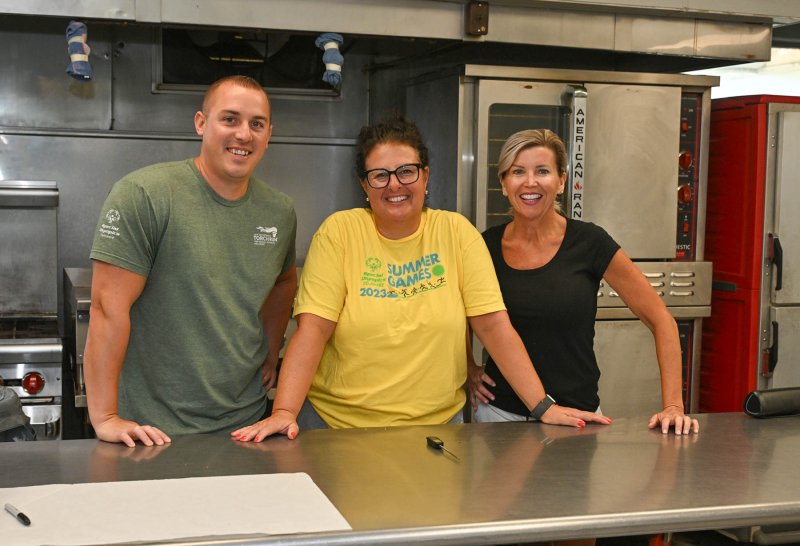 Staff working the kitchen and cooking the camp’s delectable meals are (l-r) Eric Ketterer, Bridgette Perrotta and Cynthia Winnington.