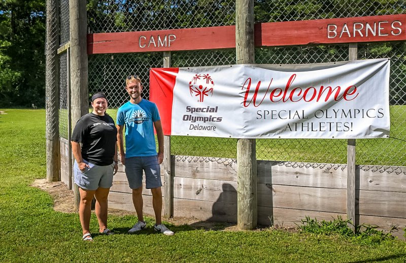 Welcoming visitors to the camp are Senior Director of Unified Champion Schools Nikki Mowbray, left, and Director of Digital Media Alex Seymore.