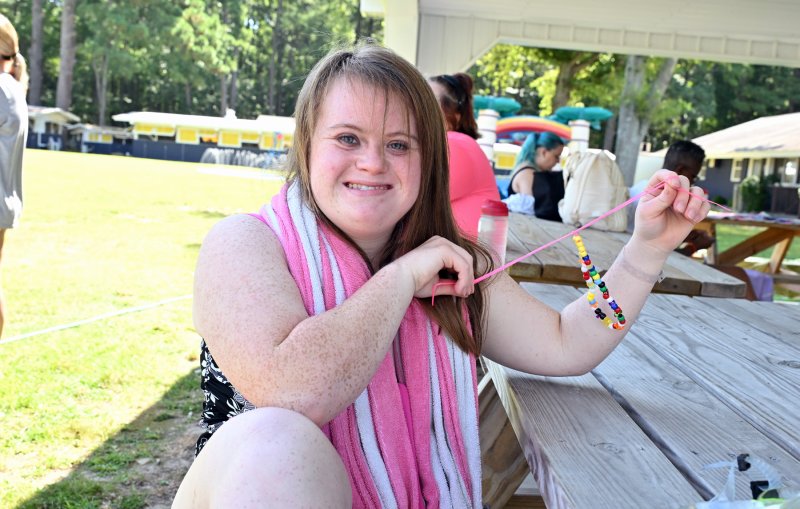Showing her handmade necklace is athlete Cailee Layton.