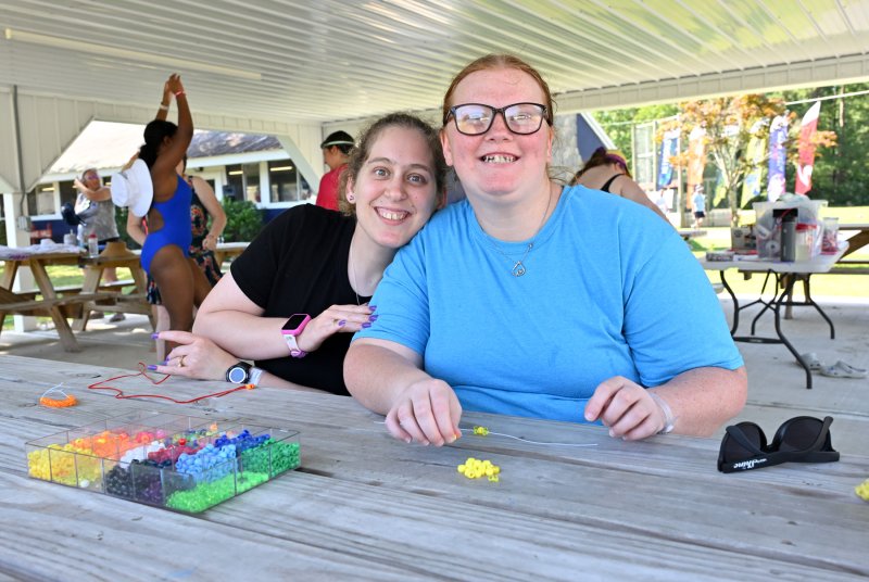Friends working on their arts project are Trinity Crouch, left, and Andrea Hastings.