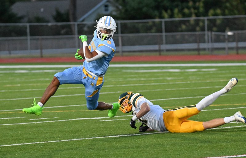 Cape back Ty Handy outruns the tackle attempt by a Saint Mark’s defensive back.