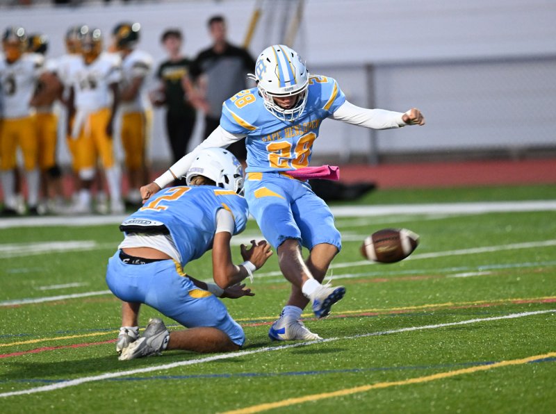 Cape junior placekicker Austin Tyndall kicks one of his three extra points.