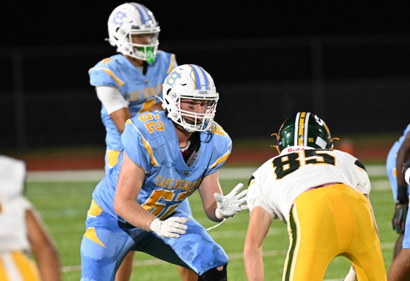 Cape senior lineman Liam Ramsey pass blocks Scott Fillingame.
