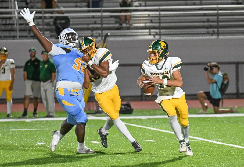 Cape’s Tremaine Batson battles through a Saint Mark’s block and chases quarterback Brett Greene.
