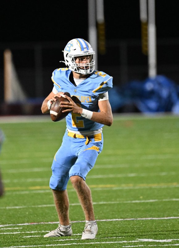 Cape quarterback Mikey Thompson looks for a receiver in the end zone.
