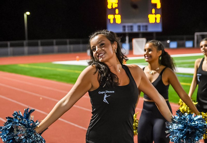 Dance team member Peyton Morris entertains the student section with her teammates.